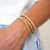 Bracelete Liso Duplo Torcido Dourado - comprar online