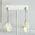 ARETES DE NOCHE LARGOS TIRA ZIRCONIAS Y PETALOS PERLA