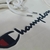 Buzo Canguro Champion Logo muñeca - Ciao Indumentaria