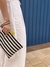 Bolso rayado Negro con Borla en internet
