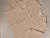 Cardigan bremer color natural con botones dorados sobre fondo beige