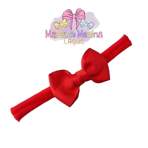Laço cruzado na faixinha para bebê