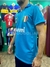 Camiseta titular del Napoli de 1986, modelo #10 de Maradona, en color azul. Se observa el logo de la selección italiana y el patrocinador.