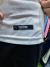 Camiseta suplente blanca de Independiente, mostrando la etiqueta de autenticidad de Puma.