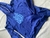 Buzo canguro azul para niño con logo de la AFA y estrellas en el diseño.