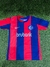Camiseta de San Lorenzo titular "Barrios" para niño, con diseño a rayas azul y roja.