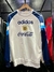 Buzo retro de Argentina 1996 en color blanco con detalles en azul y el logo de Adidas y Coca-Cola.