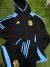 Conjunto deportivo negro para niño de Argentina, con capucha y detalles en azul claro