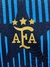 Logotipo de la Asociación del Fútbol Argentino con tres estrellas doradas sobre fondo azul y negro.