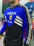 Buzo retro de Argentina 1994, con detalles en azul y negro, logo de Adidas y emblema de AFA.