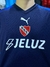 Camiseta alternativa de Independiente en color azul, con logo de Puma y el escudo del club.