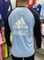 Buzo retro de Argentina 2006, con logo de Adidas y Coca-Cola, visto desde atrás.