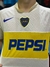 Camiseta suplente de Boca Juniors 2003, con diseño en blanco y amarillo, y logo de Pepsi en el centro.