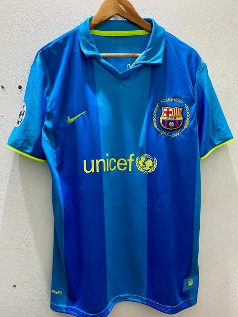 Camiseta retro del FC Barcelona de la temporada 2007/2008, en tonos azules con detalles amarillos y el logo de UNICEF.