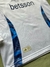 Buzo blanco de Boca Juniors con medio cierre, logotipo de Betsson y detalles en azul.