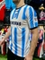 Camiseta retro de Racing del año 2004, con rayas verticales en azul y blanco, modelo de la marca Topper.