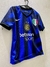 Camiseta del Inter de Milán 2024/2025 para niño, con diseño azul y negro, logo del club y detalles en verde, blanco y rojo.