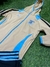 Conjunto de abrigo dorado con detalles en azul, con el escudo de la AFA, ideal para niños.