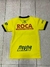 Camiseta amarilla de Defensa y Justicia para niño, con logos en la parte posterior.