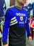 Buzo retro de Argentina 1994, con diseño en azul y negro, logotipo de Adidas y Coca-Cola.