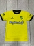 Camiseta amarilla de Defensa y Justicia para niños, con el logo del club y el patrocinador "RapiCuota$".