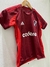 Camiseta suplente de River Plate para niños, color rojo y negro, con logo y detalles de la marca Adidas.