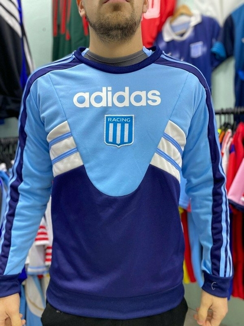 Buzo de Racing Club retro de 1994, color celeste y azul, con logo de Adidas y escudo del club.