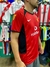 Camiseta retro del Manchester United, modelo 2003/2004, con detalles en rojo y negro, vista lateral.