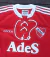 Camiseta retro de Independiente 1995, color rojo, con detalles de adidas y el escudo del club.