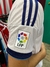 Camiseta del Real Madrid con el logo de La Liga en la manga
