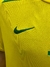 Camiseta retro de Brasil en color amarillo con el logo de Nike bordado en verde.