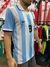 Camiseta de la selección argentina de fútbol, modelo 2000 de Reebok, con rayas celestes y blancas, número 9 y detalles en el cuello.