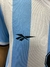 Camiseta de la selección argentina de fútbol, modelo Batistuta de 2000, con franjas celestes y blancas y logo de Reebok.