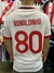 Camiseta blanca de fútbol con el nombre "RONALDINHO" y el número "80" en color rojo, vista desde atrás.