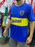 Camiseta retro de Boca Juniors del año 2000, con diseño en azul y amarillo, y logo de Quilmes.