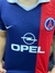 Camiseta retro de Ronaldinho del PSG de la temporada 2002/2003, con detalles en azul y rojo, logo de Opel y emblema del club.