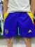 Shorts de Boca Juniors de Adidas en color azul con detalles amarillos y escudo del club.