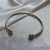 BRACELETE C/ABERT.DE ESFERAS NAS PONTAS