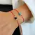 Pulsera de hilo con ojo