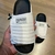 Chinelo Slide Asuna 2.0 Branco e Preto na internet