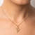 pingente rommanel folheado a ouro bailarina com detalhes vazados - 542777 - comprar online