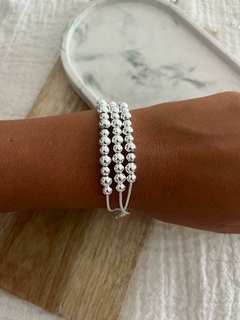 Pulsera acero blanco y triple hilera de bolitas