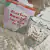 Taza de vidrio con frase y caja en internet