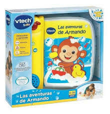 Caja del libro didáctico "Las aventuras de Armando" de Vtech, con un monito y juguetes de baño.
