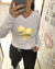Remera blanca de mujer con estampado dorado en forma de corazón que dice "Je t'aime".