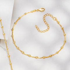 PULSEIRA CORRENTE E MINI ESFERAS DOURADAS - comprar online