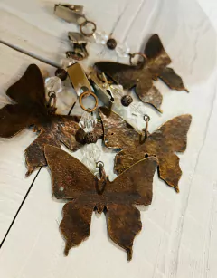 pesa mantel mariposa bronce x4