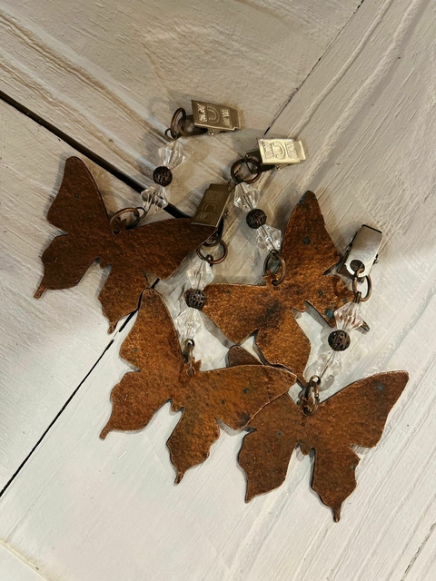 pesa mantel mariposa cobre x4