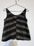 Musculosa negra y dorada