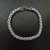 Pulsera Espiga: pulsera de acero quirúrgico, varias medidas disponibles. Presenta eslabones ovales aplanados, de tamaño no uniforme.